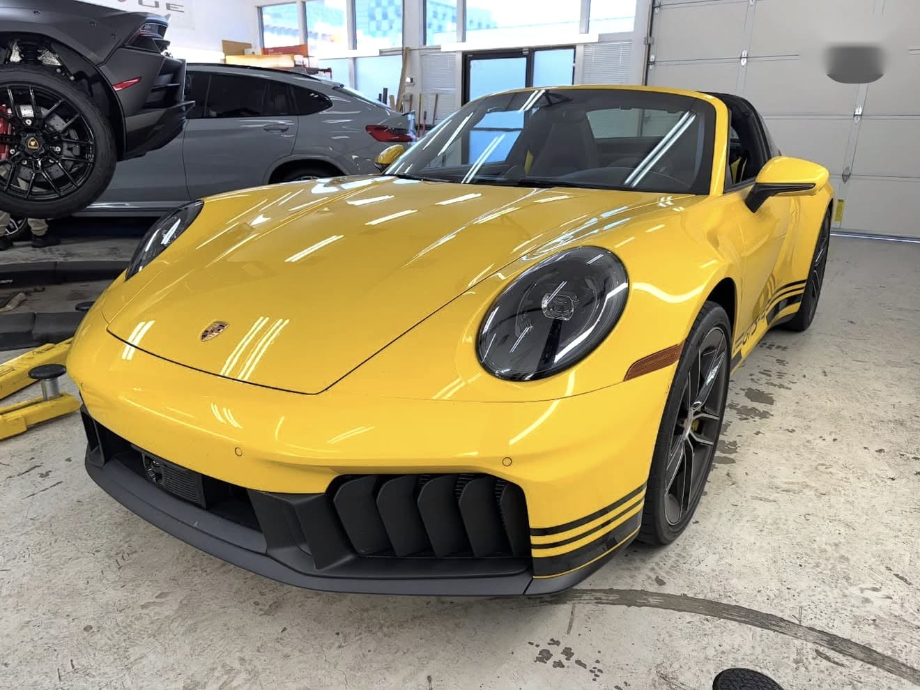 Yellow Porsche 911 Targa GTS with black accent wrapping at Wu Wraps
